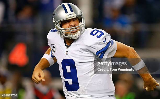 Tony Romo of the Dallas Cowboys reacts after the Cowboys score against the Detroit Lions during the second half of their NFC Wild Card Playoff game...