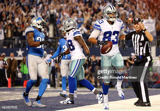 Terrance Williams of the Dallas Cowboys scores against the Detroit Lions during the second half of their NFC Wild Card Playoff game at AT&T Stadium...