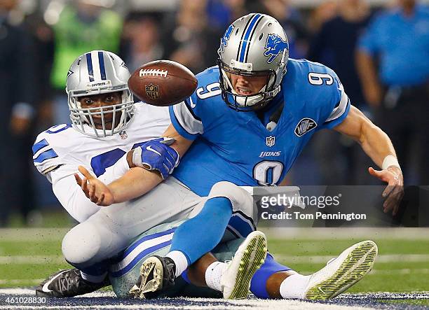 Quarterback Matthew Stafford of the Detroit Lions fumbles the ball after being sacked by defensive end Demarcus Lawrence of the Dallas Cowboys in the...