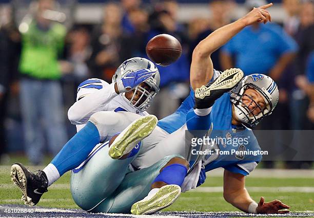 Quarterback Matthew Stafford of the Detroit Lions fumbles the ball after being sacked by defensive end Demarcus Lawrence of the Dallas Cowboys in the...