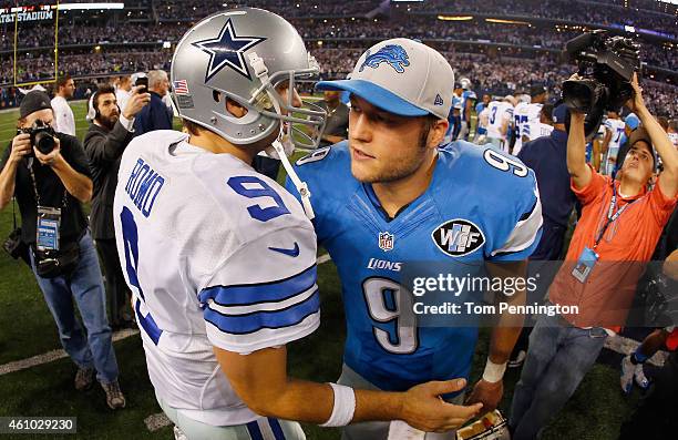 Quarterback Tony Romo of the Dallas Cowboys talks with quarterback Matthew Stafford of the Detroit Lions after the Cowboys beat the Detroit Lions...