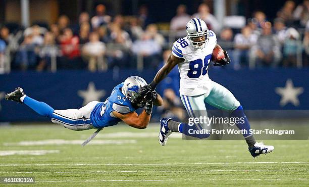 Dallas Cowboys wide receiver Dez Bryant eludes Detroit Lions outside linebacker DeAndre Levy during the third quarter on Sunday, Jan. 4 at AT&T...