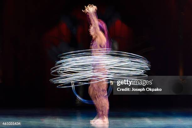 Irina Akimova performs the hoops manipulation act during the dress rehearsal for "Kooza" by Cirque Du Soleil" at Royal Albert Hall on January 4, 2015...