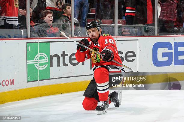 Patrick Sharp of the Chicago Blackhawks reacts after scoring the game winning goal in overtime against the Dallas Stars during the NHL game at the...