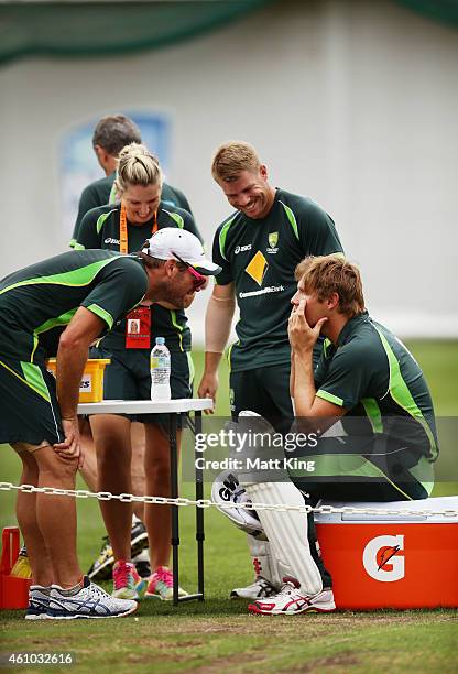 Ryan Harris and David Warner look into the eyes of Shane Watson during an Australian nets session at Sydney Cricket Ground on January 5, 2015 in...