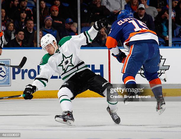 Cal Clutterbuck of the New York Islanders steps into Valeri Nichushkin of the Dallas Stars during the first period at the Nassau Veterans Memorial...