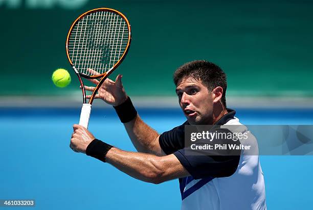 Federico Delbonis of Argentina plays a backhand during his first round match against Donald Young of the USA during day two of the Heineken Open at...