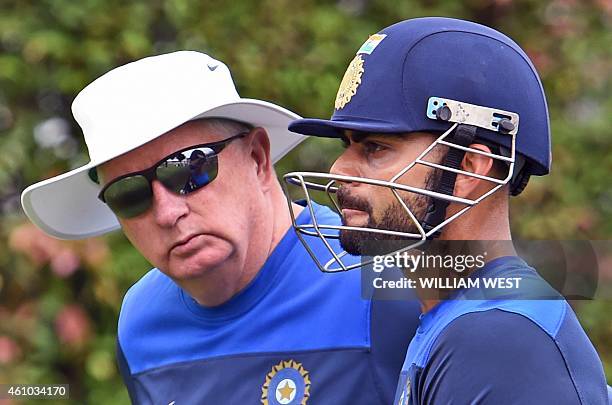 India's coach Duncan Fletcher chats with captain Virat Kohli during cricket training at the Sydney Cricket Ground on January 5, 2015. Australia are...