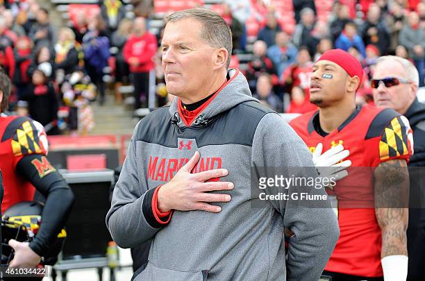 Head coach Randy Edsall of the Maryland Terrapins stands for the national anthem before the game against the Rutgers Scarlet Knights at Byrd Stadium...