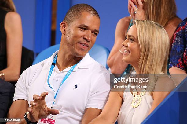 Blake Garvey and Louise Pillidge watch the action during day two of the 2015 Hopman Cup at Perth Arena on January 5, 2015 in Perth, Australia.