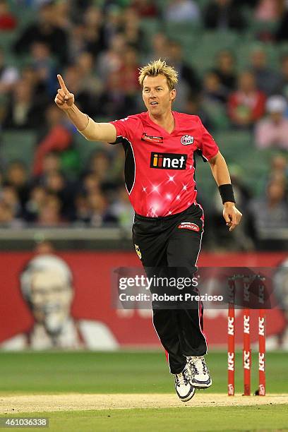 Brett Lee of the Sixers celebrates after taking the wicket of Luke Wright of the Stars during the Big Bash League match between the Melbourne Stars...