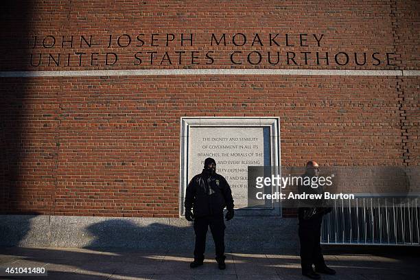 Law enforcement officials stand guard outside John Joseph Moakley United States Courthouse, where jury selection is beginning today in the case...