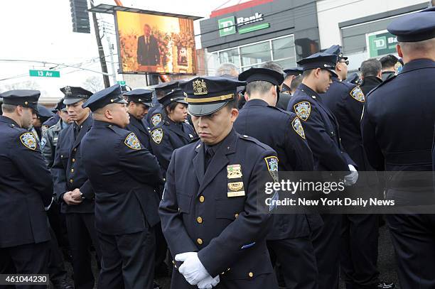 Police turn their backs to Mayor Bill de Blasio as he speaks at funeral of NYPD cop Wenjian Liu at Aievoli Funeral Home in Bensonhurst . Liu was...