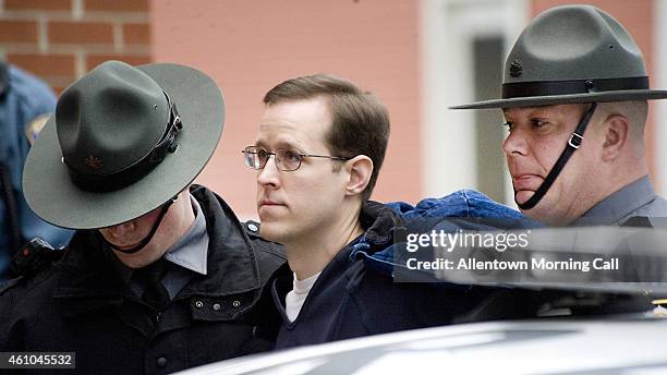 Eric Frein is escorted to a preliminary hearing on Monday, Jan. 5, 2015 at the Pike County Courthouse in Milford, Pa. Frein of Canadensis, is the...