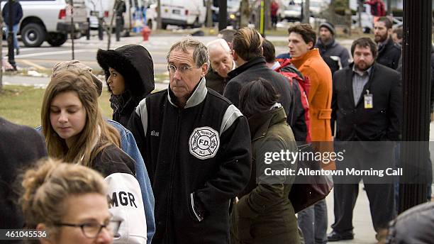 People wait in line on Monday, Jan. 5, 2015 to enter the Pike County Courthouse in Milford, Pa. On Monday, a preliminary hearing was held for Eric...