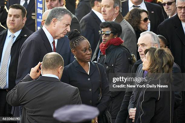 New York City Mayor Bill de Blasio, his wife Chirlane McCray, and New York Police Department commissioner Bill Bratton arrive at the funeral for New...