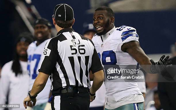 Dez Bryant of the Dallas Cowboys argues with side judge Allen Baynes after a penatly was called against Anthony Hitchens of the Dallas Cowboys when...