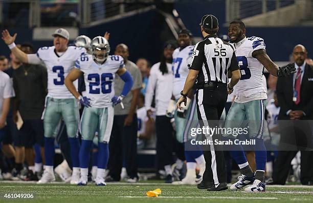 Dez Bryant of the Dallas Cowboys argues with side judge Allen Baynes after a penatly was called against Anthony Hitchens of the Dallas Cowboys when...