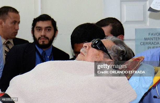 Former Guatemalan de facto president , retired General Jose Efrain Rios Montt, arrives on a stretcher as a retrial against him opens in Guatemala...