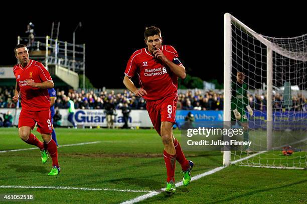 Steven Gerrard of Liverpool celebrates after scoring the opening goal with a header during the FA Cup Third Round match between AFC Wimbledon and...