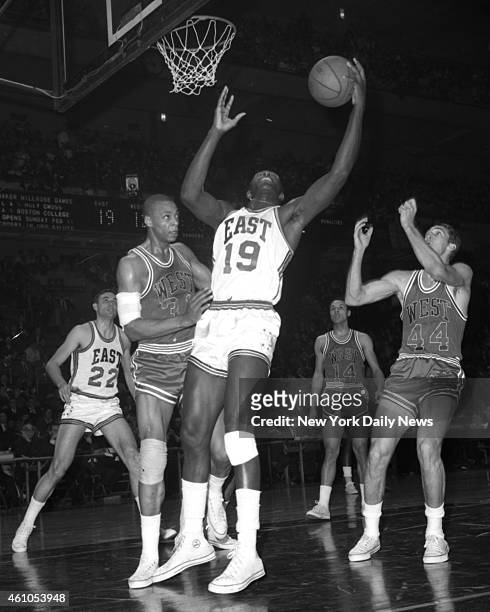Basketball All Star Game East vs West Later in the first quarter, NY Knicks' Willis Reed fights Hawks' Zelmo Beaty for rebound. The East, favored by...