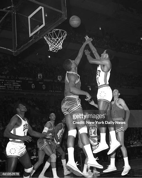 Basketball All Star Game East vs West NBA'S leading scorer, Dave Bing , of Detroit and the East squad, pops shot over outstretched hands of Chicago...