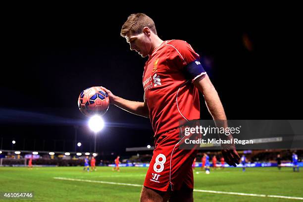 Steven Gerrard of Liverpool prepares to take a corner during the FA Cup Third Round match between AFC Wimbledon and Liverpool at The Cherry Red...