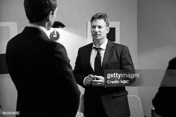 Episode 0138-- Pictured: Host Seth Meyers talks with journalist Richard Engel backstage on December 10, 2014 --