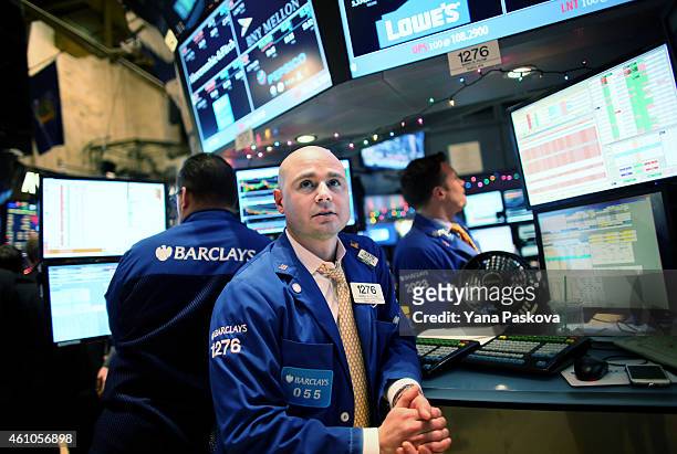 Trader works on the floor of the New York Stock Exchange at the end of the trading day on January 05, 2015 in New York City. U.S. Stocks fell over...