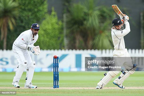 Watling of New Zealand bats while Prasanna Jayawardene of Sri Lanka looks on during day four of the Second Test match between New Zealand and Sri...