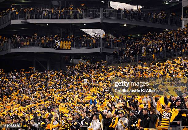 View as Steeler fans wave their terrible towels during the Wild Card game between the Pittsburgh Steelers and the Baltimore Ravens on January 3, 2015...