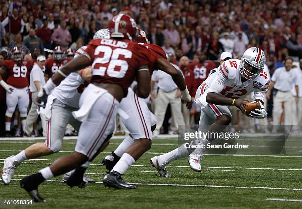 Cardale Jones of the Ohio State Buckeyes in action against the Alabama Crimson Tide during the All State Sugar Bowl at the Mercedes-Benz Superdome on...