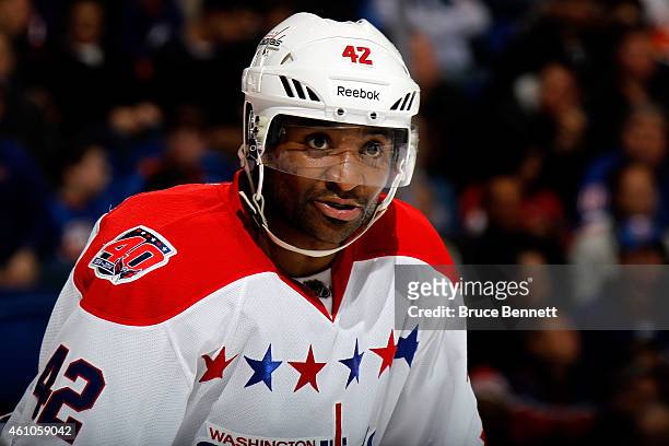Joel Ward of the Washington Capitals looks on against the New York Islanders during a game at the Nassau Veterans Memorial Coliseum on December 29,...