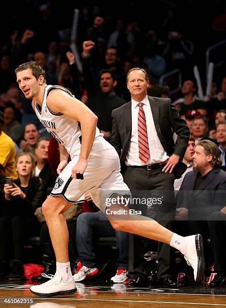 Mirza Teletovic of the Brooklyn Nets celebrates his three point basket in the fourth quarter against the Atlanta Hawks at the Barclays Center on...