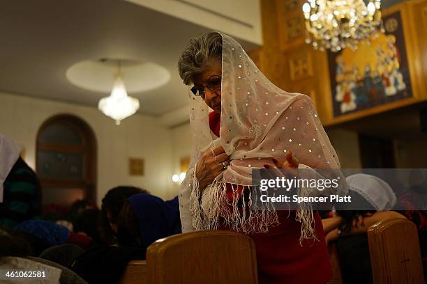 Egyptian Coptic Christians pray as they celebrate Christmas Nativity Liturgy, the start of Christmas, at the Coptic Orthodox Church of St. George on...