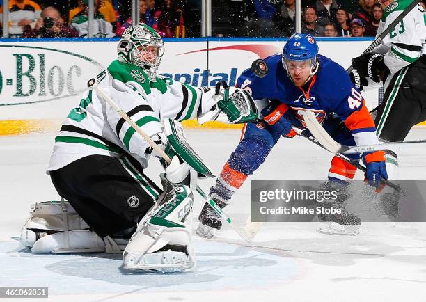 Kari Lehtonen of the Dallas Stars makes a save against Michael Grabner of the New York Islanders at Nassau Veterans Memorial Coliseum on January 6,...