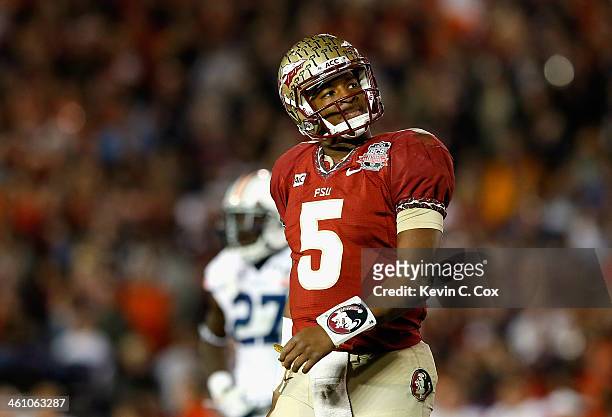 Quarterback Jameis Winston of the Florida State Seminoles reacts to a play against the Auburn Tigers during the 2014 Vizio BCS National Championship...