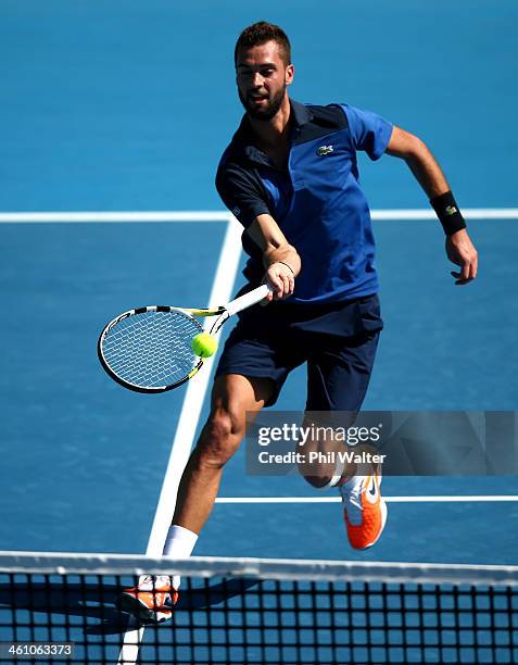 Benoit Paire of France plays a forehand during his first round match against Michal Przysiezny of Poland during day two of the Heineken Open at the...