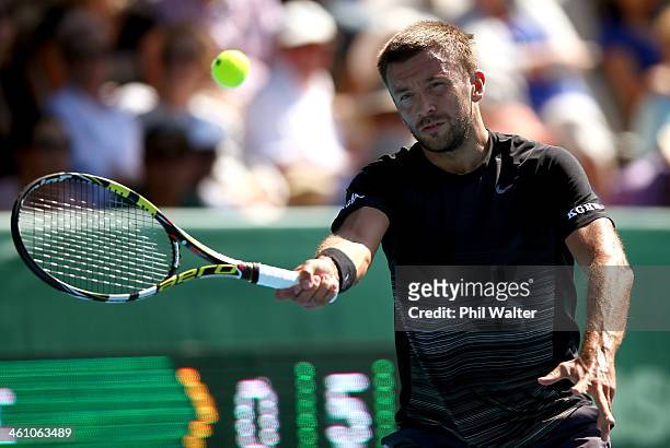 Michal Przysiezny of Poland plays a forehand during his first round match against Benoit Paire of France on day two of the Heineken Open at the ASB...