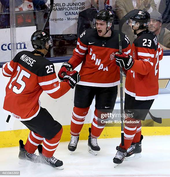 Canada celebrates Domi goal, from left, Darnell Nurse, Max Dopmi and Sam Reinhart. 2015 IIHF World Junior Championship hockey, 2nd period action of...