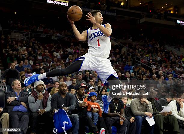 Michael Carter-Williams of the Philadelphia 76ers saves the ball from going out of bounds against the Cleveland Cavaliers on January 5, 2015 at the...