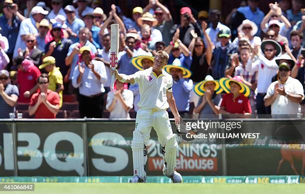 Australia's batsman David Warner waves to fans after being dismissed by India on the first day of the fourth cricket Test at the Sydney Cricket...