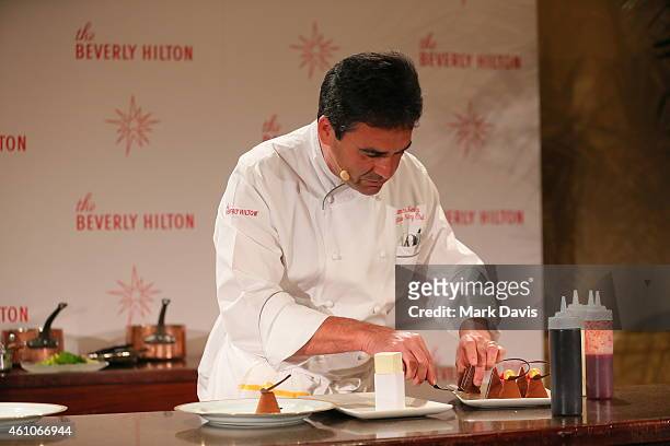 Executive Pastry Chef Thomas Henzi poses with a dessert item as the The Beverly Hilton reveals the menu for the 72nd annual Golden Globe awards held...