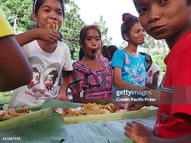 Badjao children enjoy the boodle fight meal prepared by the Philippine Marines for them who attended school patiently.