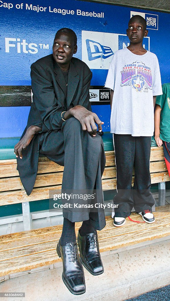 14-year-old Bol Bol, son of Manute, reaches for his fatherís heights