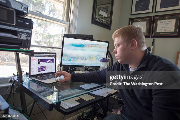 Kyle Craven checks his Bad Luck Brian Youtube page at his home office in Cuyahoga Falls, Ohio on December 26, 2014.