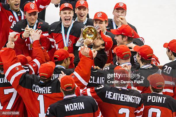 Robby Fabri of Canada kisses the cup after a 5-4 win over Russia during the Gold medal game of the 2015 IIHF World Junior Championship on January 05,...