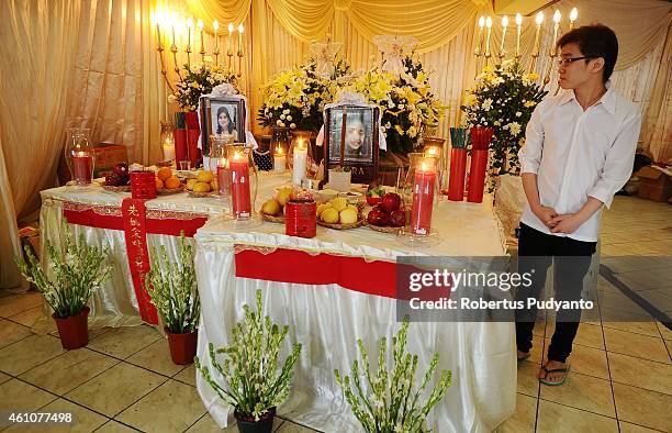 The remains of The Meiji Tejakusuma and her daughter Jie Stevie Gunawan, victims of the AirAsia flight QZ8501 disaster, are laid out at Adi Yasa...