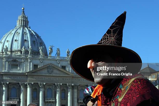 Person dressed as Befana waits in St Peter's Square during the Feast of the Epiphany for Pope Francis' Angelus blessing on January 6, 2015 in Vatican...