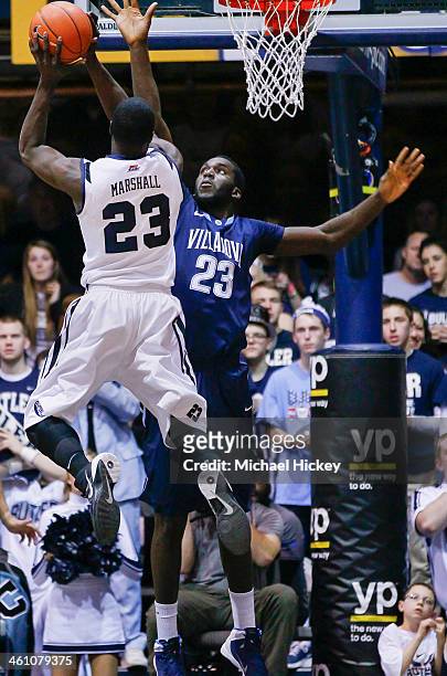 Khyle Marshall of the Butler Bulldogs shoots the ball against Daniel Ochefu of the Villanova Wildcats at Hinkle Fieldhouse on December 31, 2013 in...
